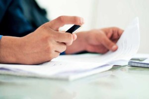 man holding pen contract signing house title contract